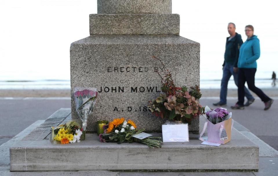 Tributes were laid by the seafront in Swanage (PA)