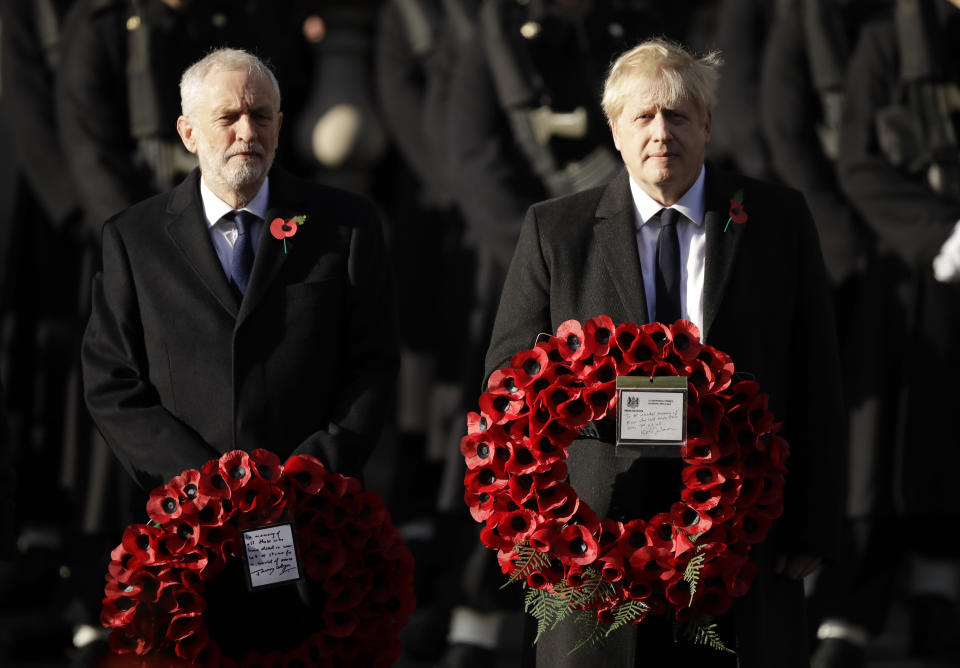 British Prime Minister Boris Johnson, right, and leader of the Labour Party Jeremy Corbyn prepare to lay wreaths during the Remembrance Sunday ceremony at the Cenotaph in Whitehall in London, Sunday, Nov. 10, 2019. Remembrance Sunday is held each year to commemorate the service men and women who fought in past military conflicts. (AP Photo/Matt Dunham)