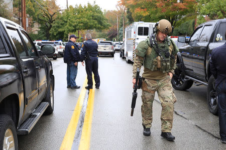 A SWAT police officer and other first responders respond after a gunman opened fire at the Tree of Life synagogue in Pittsburgh, Pennsylvania, U.S., October 27, 2018. REUTERS/John Altdorfer