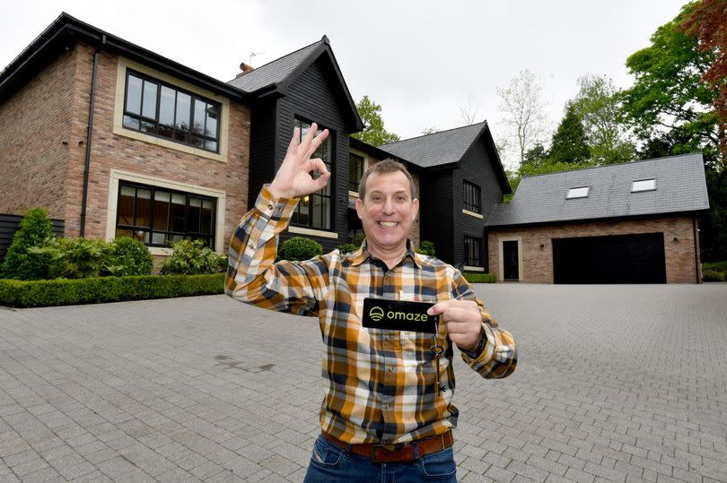 Kevin Bryant outside the £3.5m Cheshire mansion he won in an Omaze draw -Credit:Omaze