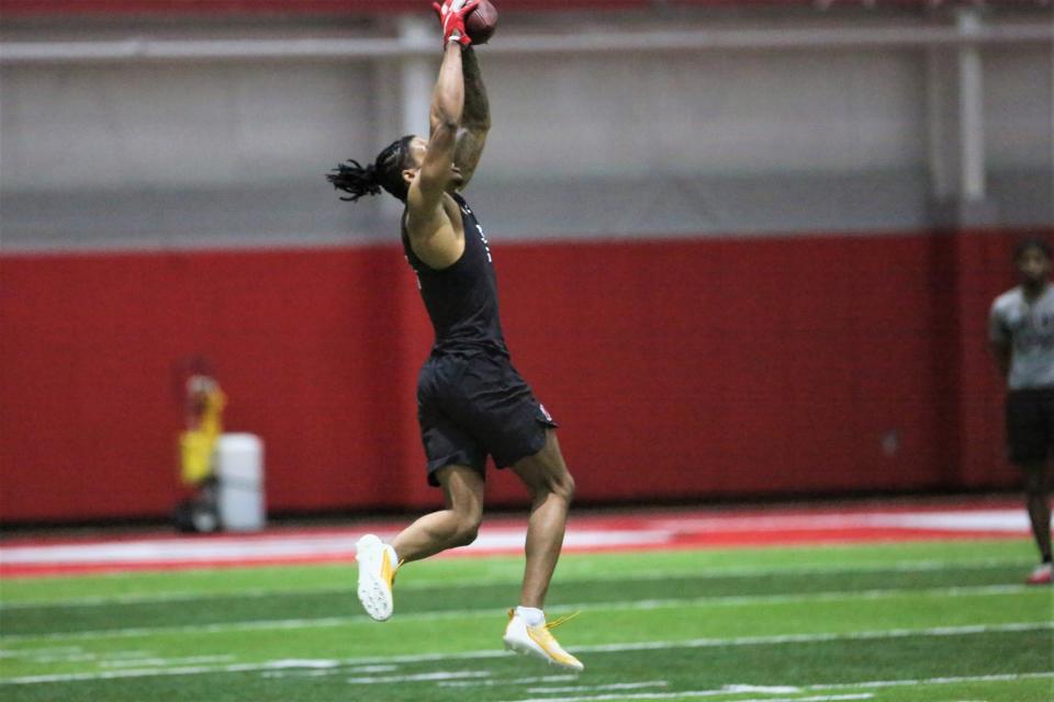 Ball State football wide receiver Yo’Heinz Tyler catches a pass during the program's Pro Day at the Scheumann Family Indoor Practice Center on Monday, March 27, 2023.