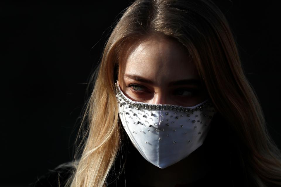 Woman wearing face mask in Prague, Czech Republic, Friday March 27, 2020.