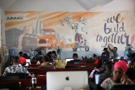 People work on computers at the online store Jumia in Ikeja district, in Nigeria's commercial capital Lagos June 10, 2016.REUTERS/Akintunde Akinleye