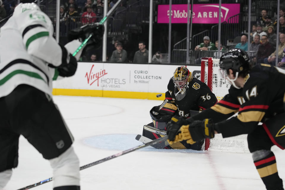 Vegas Golden Knights goaltender Logan Thompson (36) blocks a shot by Dallas Stars center Radek Faksa (12) during the first period of an NHL hockey game Monday, Jan. 16, 2023, in Las Vegas. (AP Photo/John Locher)