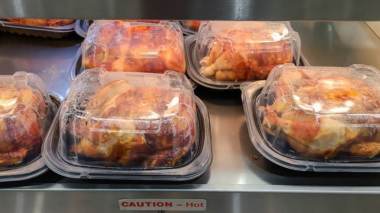 Several Costco rotisserie chickens in a deli warmer