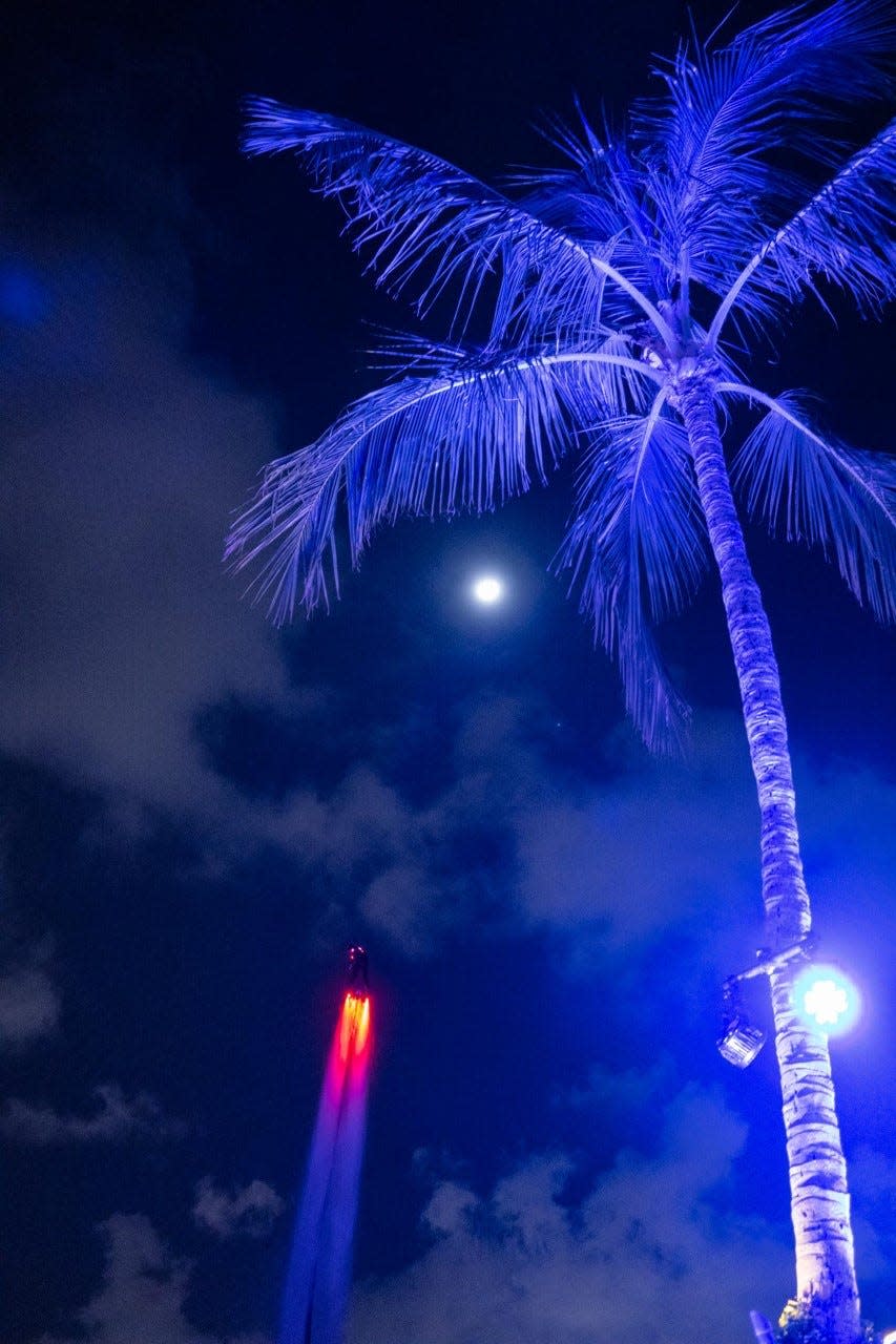 A daredevil with a jetpack put on a one-man aerobatics show during cocktails