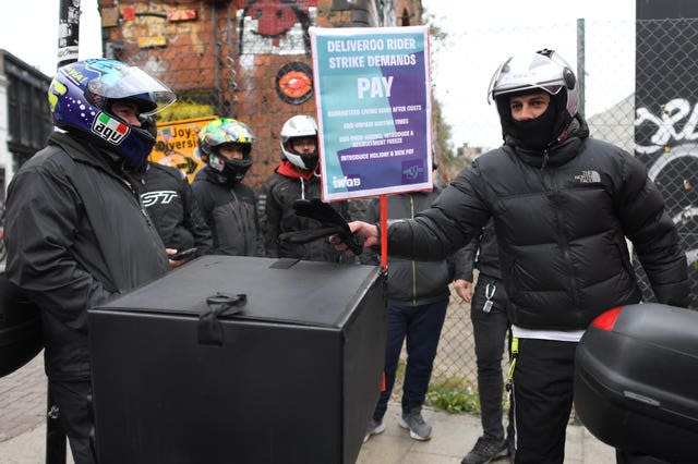 Deliveroo riders from the Independent Workers’ Union of Great Britain in Shoreditch High Street, east London, as they go on strike 