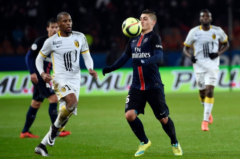 Paris Saint-Germain's Marco Verratti (R) controls the ball next to Lille's defender Djibril Sidibe (L) during the French L1 match at the Parc des Princes stadium in Paris, on February 13, 2016