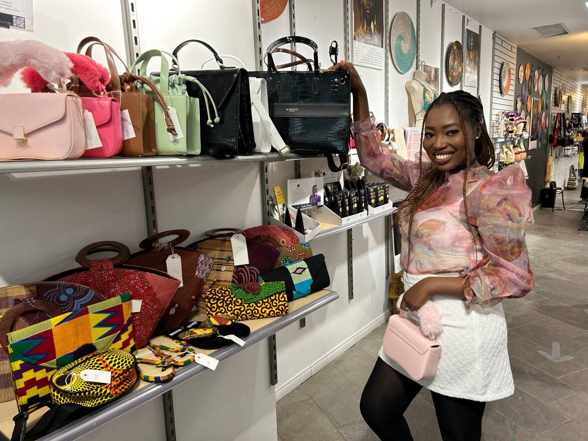 Aisha Temfack sells her line of purses at the Black Woman Market. (Kwabena Oduro/CBC - image credit)