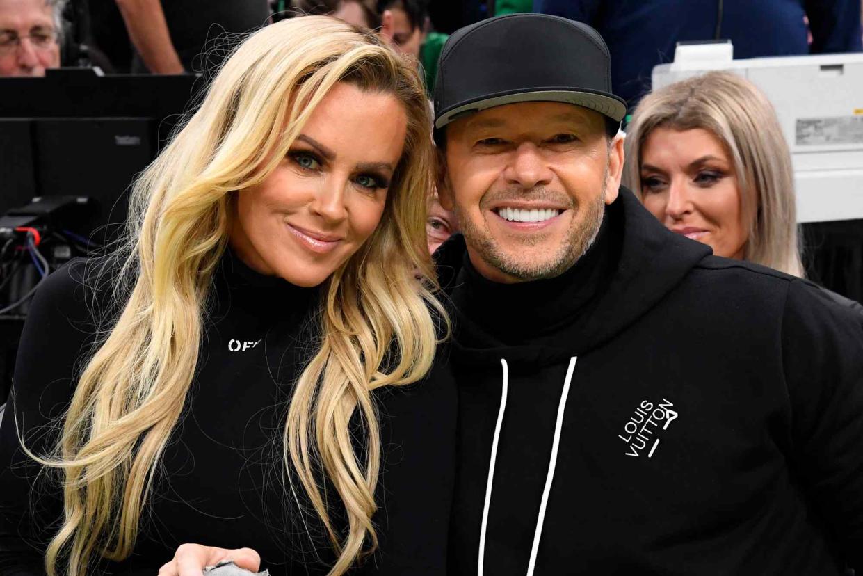 <p>Brian Babineau/NBAE via Getty</p> Jenny McCarthy and Donnie Wahlberg attend the game between the Philadelphia 76ers and the Boston Celtics on December 1, 2023