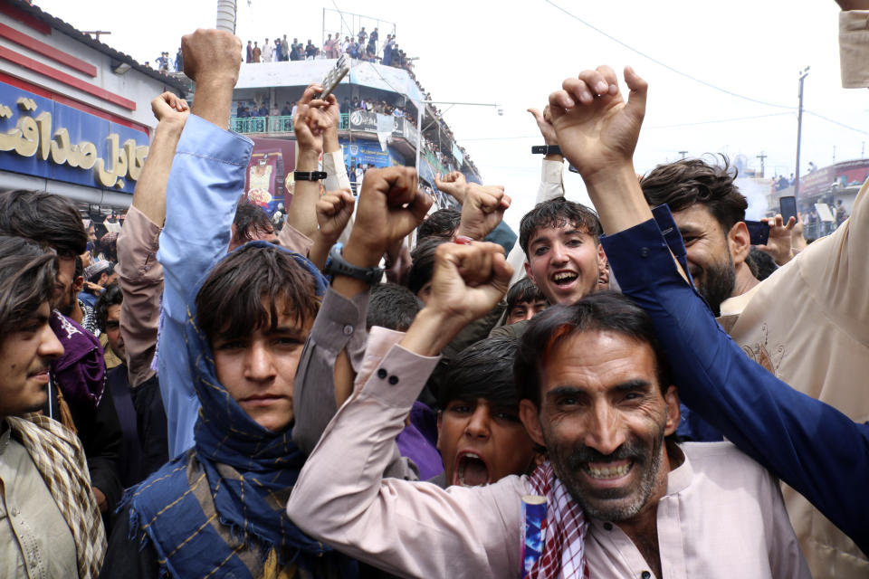 Afghan cricket fans celebrate their team's victory during the men's T20 World Cup cricket match between Afghanistan and Bangladesh, in the city of Khost province eastern of Afghanistan, Tuesday, June. 25, 2024. Afghanistan edged Bangladesh to reach the Twenty20 World Cup semifinals for the first time and followed India into the last four following a combination of results that eliminated 2021 champion Australia on Monday. (AP Photo/Saifullah Zahir)