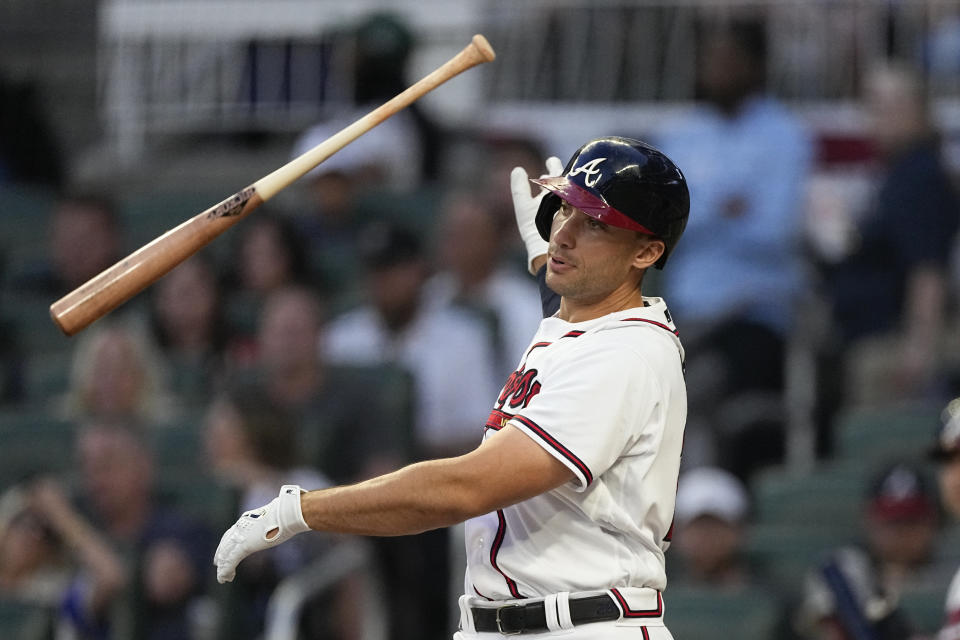 Atlanta Braves' Matt Olson lets go of the bat as strikes out to end the second inning of the team's baseball game against the Cincinnati Reds on Wednesday, April 12, 2023, in Atlanta. (AP Photo/John Bazemore)