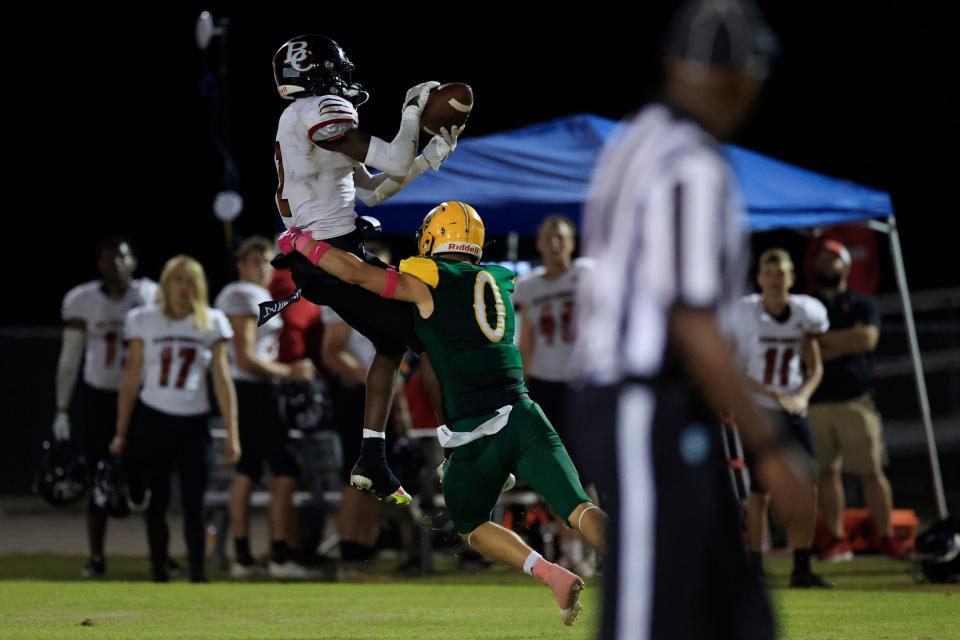 Baker County's Davion Dean (2) hauls in a reception against Yulee in 2022. Dean, who played multiple positions for the Wildcats last year, enters preseason at quarterback.