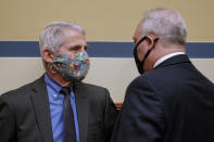 Dr. Anthony Fauci, director of the National Institute of Allergy and Infectious Diseases, speaks with Rep. Steve Scalise, R-La., after a House Select Subcommittee hearing on Capitol Hill in Washington, Thursday, April 15, 2021, on the coronavirus crisis. (Amr Alfiky/The New York Times via AP, Pool)