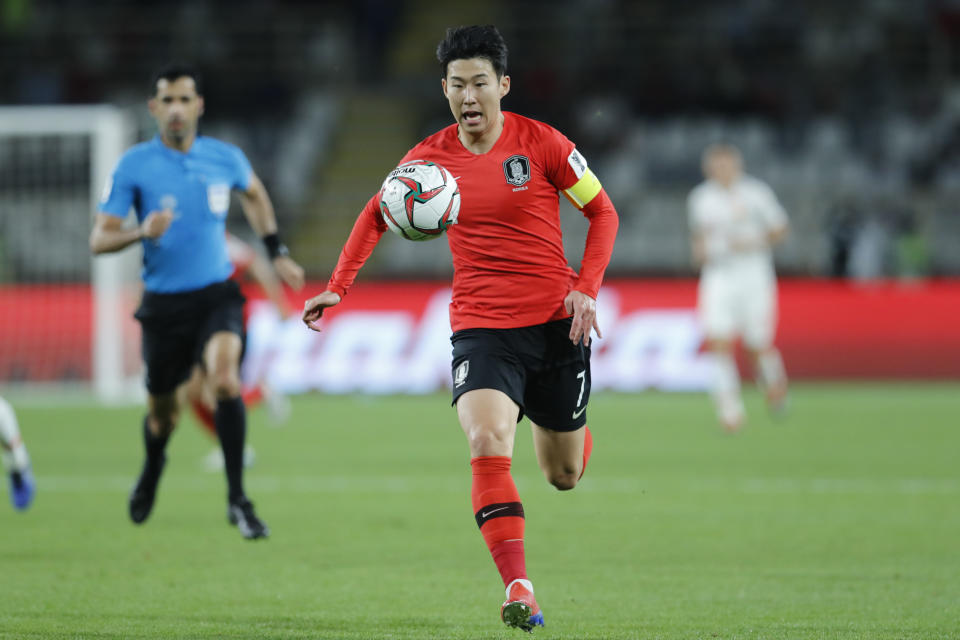 South Korea's forward Son Heung-Min runs with the ball during the AFC Asian Cup group C soccer match between South Korea and China at Al Nahyan Stadium in Abu Dhabi, United Arab Emirates, Wednesday, Jan. 16, 2019. (AP Photo/Hassan Ammar)