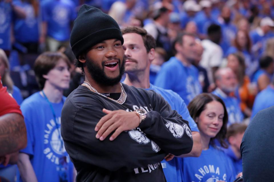 Kyler Murray watches players warm up before Game 2 of the Western Conference semifinals NBA playoff game between the Oklahoma City Thunder and the Dallas Mavericks at Paycom Center in Oklahoma City, Thursday, May, 9, 2024.