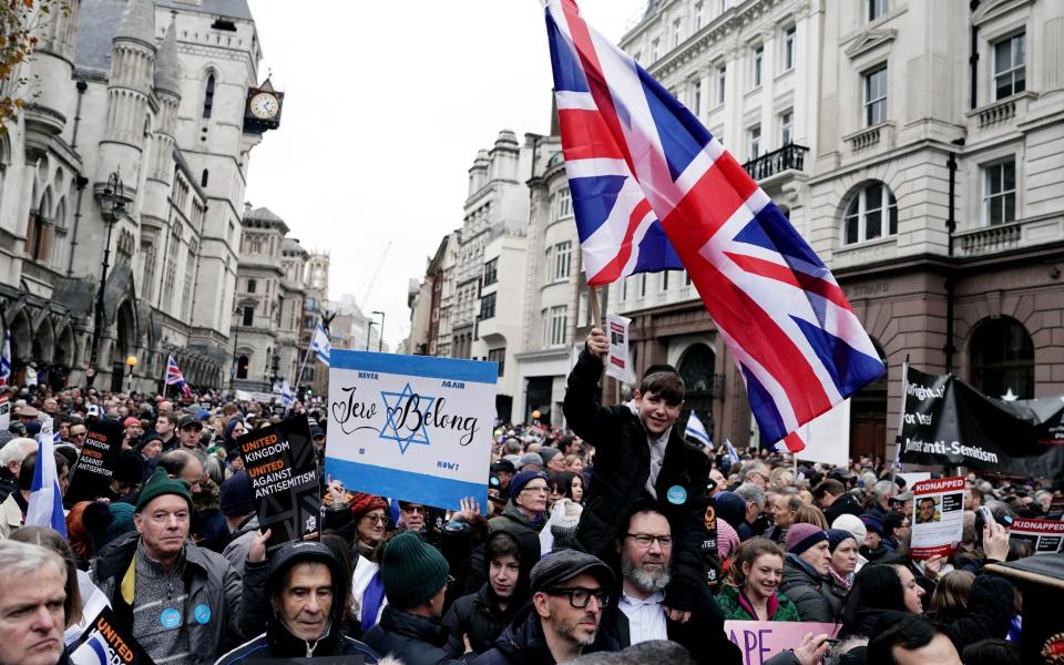 People take part in a march against antisemitism organised by the volunteer-led charity Campaign Against Antisemitism at the Royal Courts of Justice in London. Picture date: Sunday November 26, 2023. PA Photo. See PA story POLITICS Israel. Photo credit should read: Jordan Pettitt/PA Wire