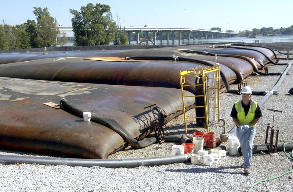 Geotextile tubes are used to dewater PCB-contaminated sediment dredged from Little Lake Butte des Morts in 2004 before the sediment is hauled to a landfill.