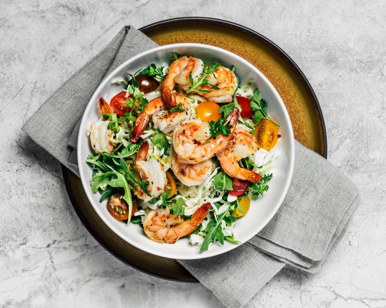 shrimp salad in a bowl on white background