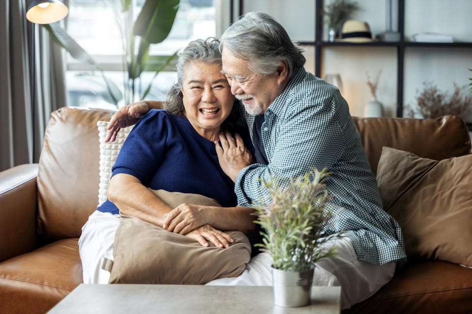 older couple cuddling on the couch