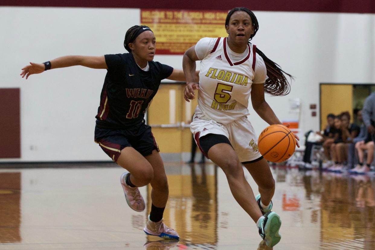 Florida High senior guard Tonie Morgan (5) drives down the court in a game against Wekiva on Jan. 21, 2022 at Florida High. The Seminoles won, 55-45.