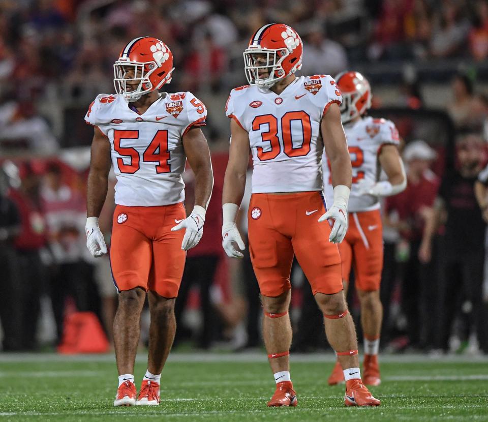 Clemson linebacker Jeremiah Trotter Jr. (54) and linebacker Keith Maguire (30) during the second quarter of the 2021 Cheez-It Bowl at Camping World Stadium in Orlando, Florida Wednesday, December 29, 2021.