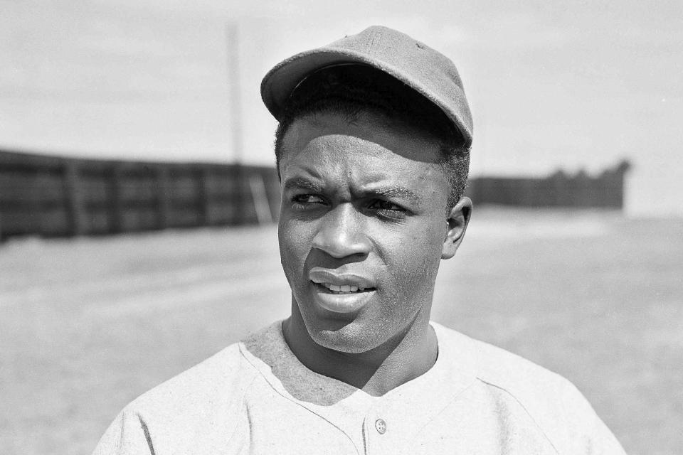 FILE - Baseball Player Jackie Robinson with the Montreal Royals club at Sanford, Fla., March 4, 1946. Major League Baseball said Tuesday, May 28, 2024, that it has incorporated records for more than 2,300 Negro Leagues players following a three-year research project. Robinson was credited with 49 hits for the 1945 Kansas City Monarchs of the Negro American League, raising his total to 1,567. (AP Photo/Bill Chaplis, File)