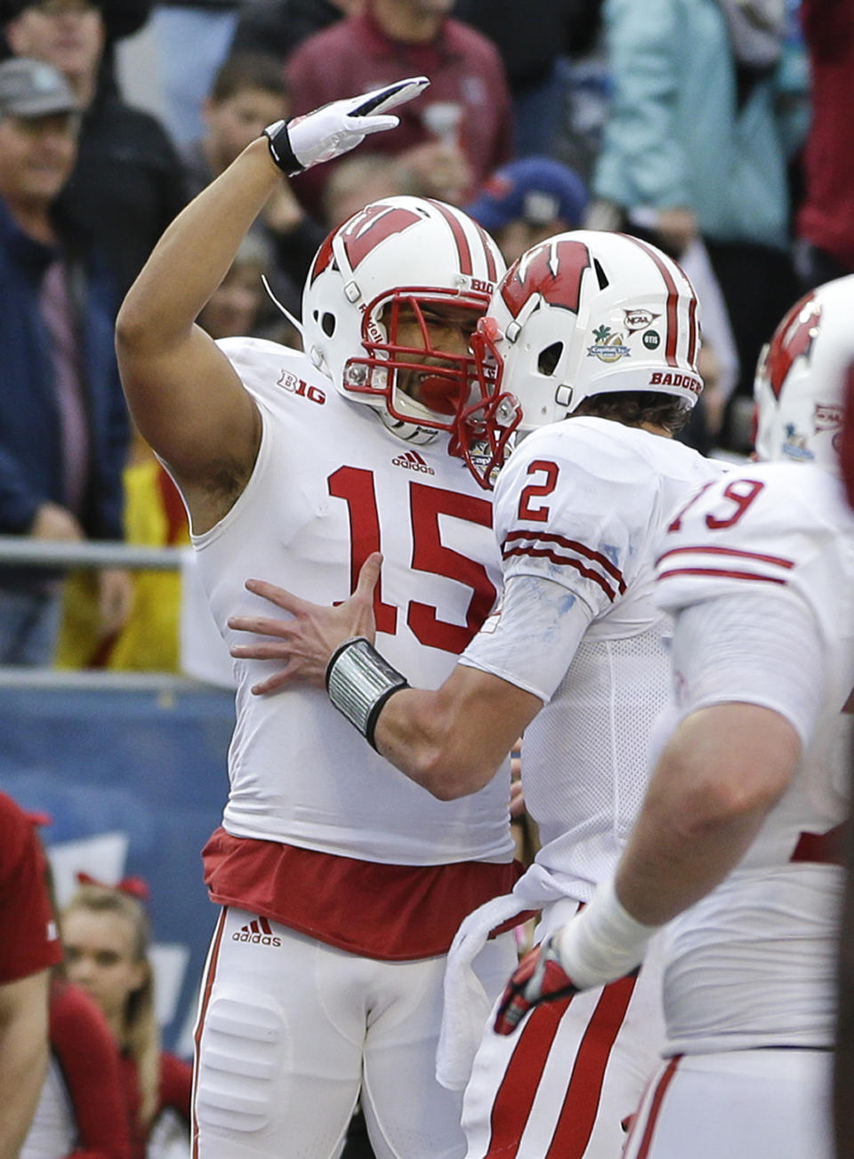 Wisconsin wide receiver Jeff Duckworth (15) celebrates a touchdown catch against South Carolina with quarterback Joel Stave (2) during the first half of the Capital One Bowl NCAA college football game in Orlando, Fla., Wednesday, Jan. 1, 2014.(AP Photo/John Raoux)