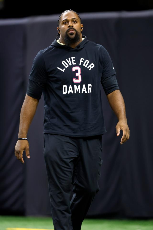 Arizona Cardinals defensive end J.J. Watt wears a shirt for Damar Hamlin  during warms up before an NFL football game against the San Francisco 49ers  in Santa Clara, Calif., Sunday, Jan. 8