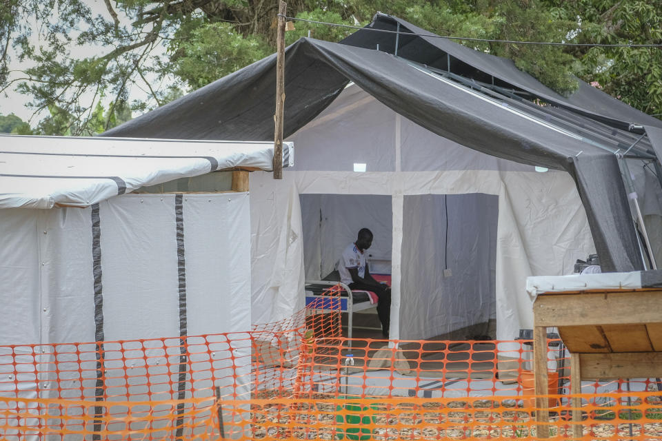 An Ebola patient sits inside the Ebola isolation center of Madudu Health Center III, in the village of Madudu, in the Mubende district of Uganda Tuesday, Nov. 1, 2022. Ugandan health officials say they have controlled the spread of a strain of Ebola that has no proven vaccine, but there are pockets of resistance to health measures among some in rural communities where illiteracy is high and restrictions on movement and business activity have left many bitter. (AP Photo/Hajarah Nalwadda)