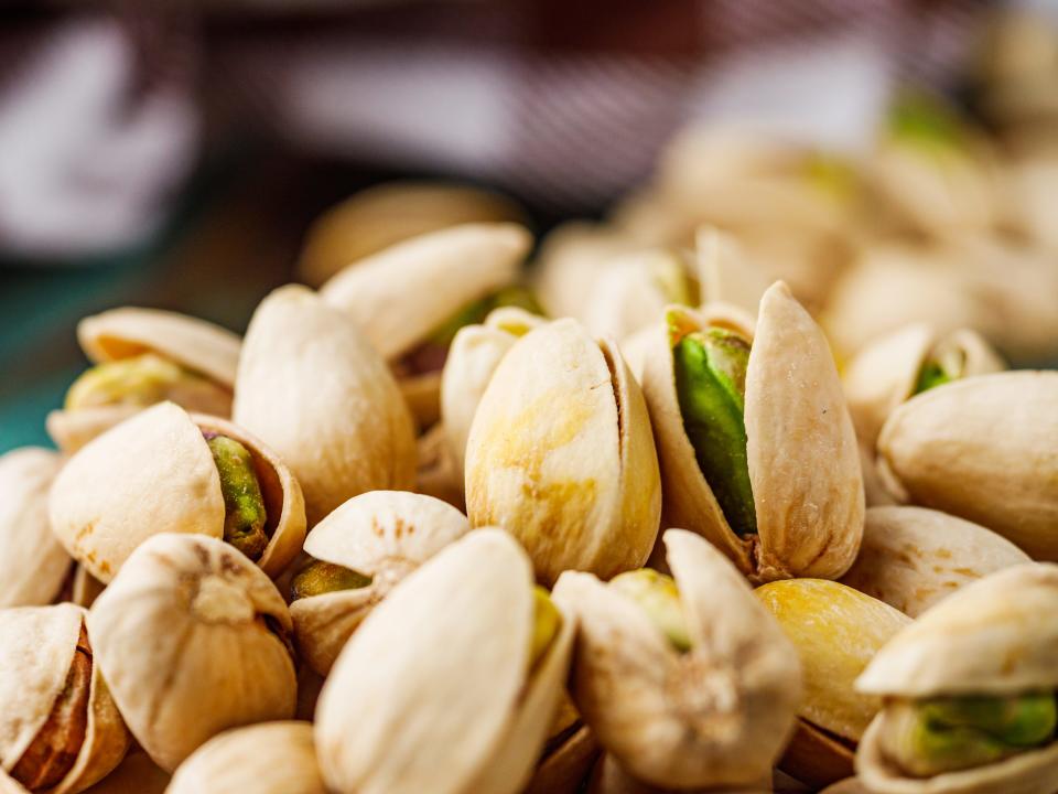 pile of salted shelled pistachio nuts