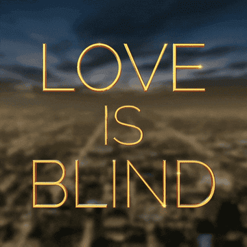 The image features the text "LOVE IS BLIND" prominently in the foreground with a blurred background