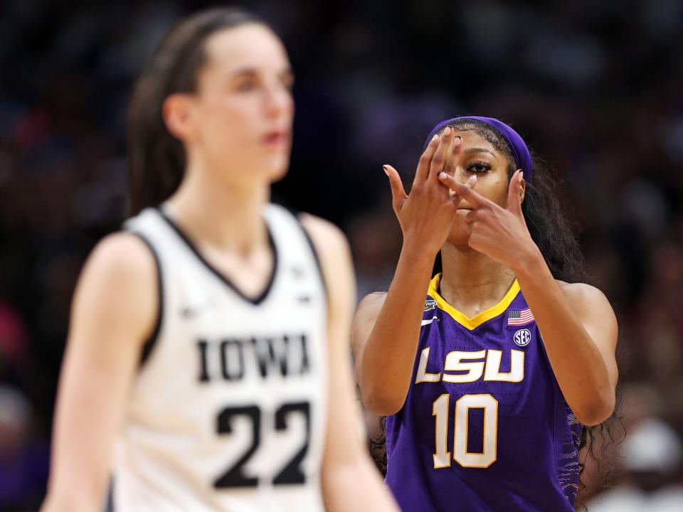 Angel Reese #10 of the LSU Lady Tigers reacts towards Caitlin Clark #22 of the Iowa Hawkeyes during the fourth quarter during the 2023 NCAA Women's Basketball Tournament championship game at American Airlines Center on April 02, 2023 in Dallas, Texas