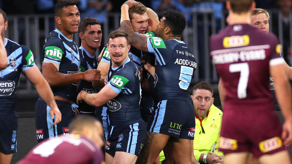 Tom Trbojevic celebrates with teammates. (Photo by Cameron Spencer/Getty Images)