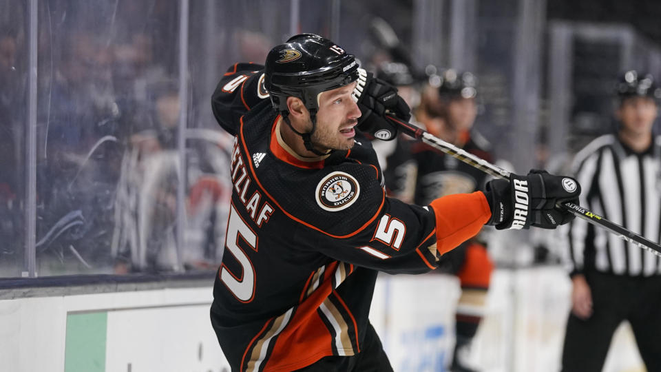 The Ducks' Ryan Getzlaf hits the puck during the second period of a preseason NHL hockey game against the Sharks on Thursday. (AP Photo)