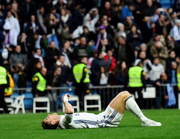 Real Madrid's forward Cristiano Ronaldo lies on the ground at the end of the Spanish league football match against Malaga on January 21, 2017