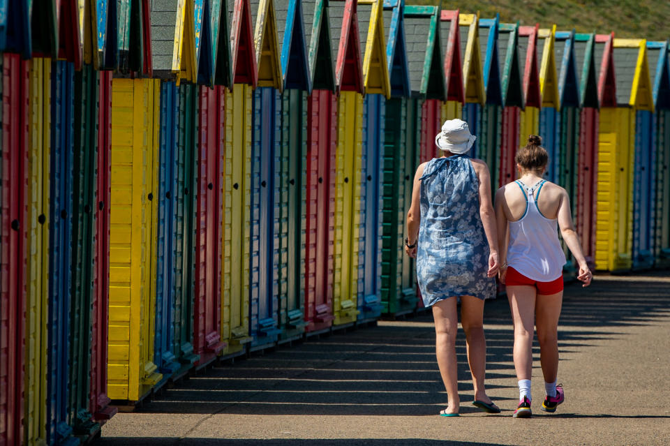 People visit Whitby, North Yorkshire, as temperatures rose above the mid-20s.