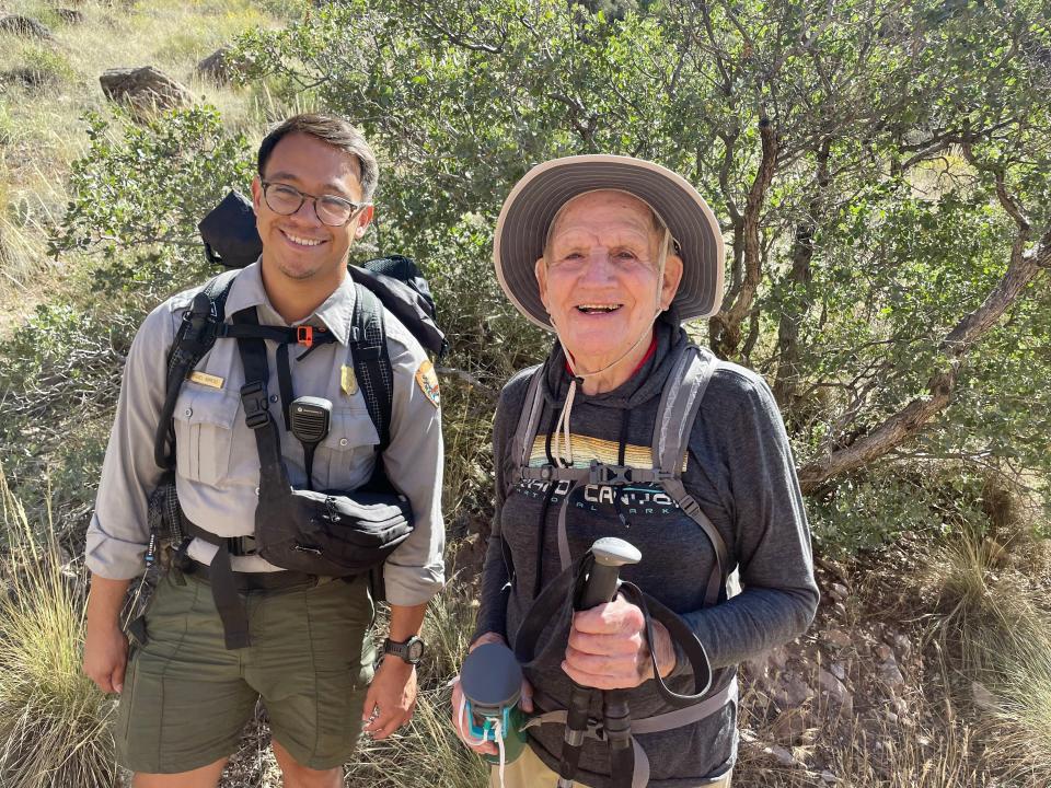 Alfredo Aliaga, 92, is pictured with a park ranger during his 24-mile rim-to-rim hike of the Grand Canyon on Oct. 14 and 15, 2023.