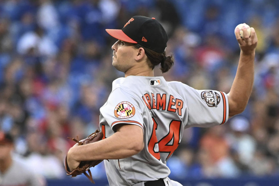 Baltimore Orioles starting pitcher Dean Kremer throws to a Toronto Blue Jays batter during the first inning of a baseball game Tuesday, Aug. 16, 2022, in Toronto. (Jon Blacker/The Canadian Press via AP)