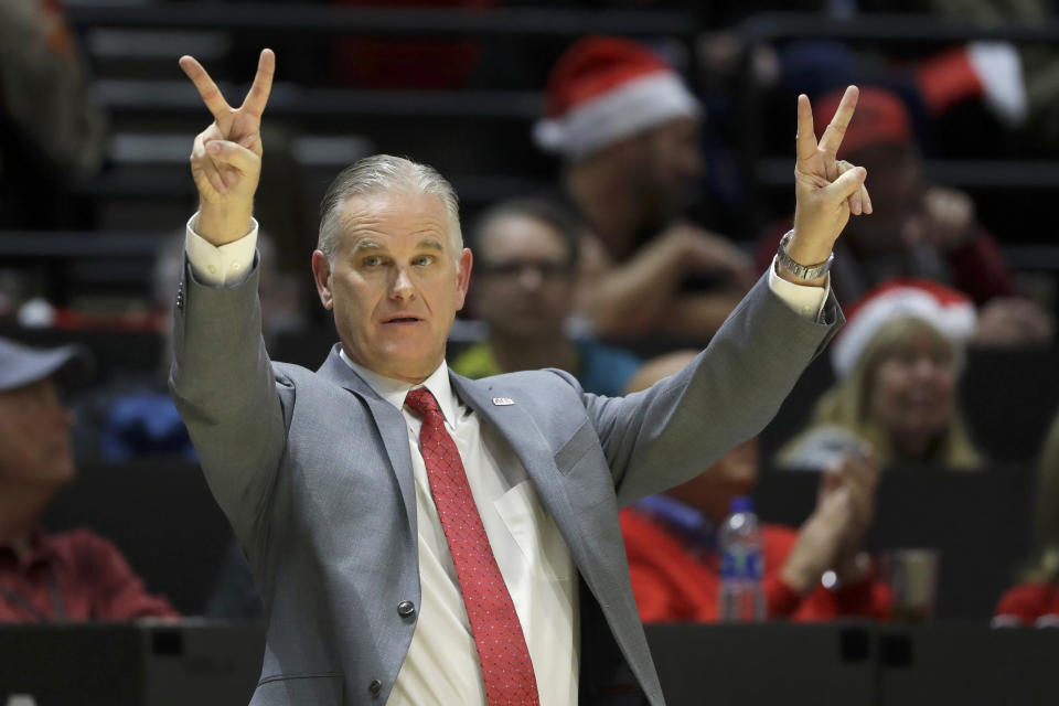 FILE - In this Dec. 18, 2019, file photo, San Diego State head coach Brian Dutcher reacts during the second half of an NCAA college basketball game against San Diego Christian in San Diego. It's almost like coach Dutcher and the San Diego State Aztecs won the lottery. Tired of losing at their old schools, big man Yanni Wetzell and guards Malachi Flynn and KJ Feagin transferred to San Diego State after being lured by the prospect of winning and going to the NCAA Tournament. And boy, have they ever won, to the point that they've matched some accomplishments by the breakthrough 2010-11 team led by the most famous player in program history, Kawhi Leonard. (AP Photo/Gregory Bull, File)