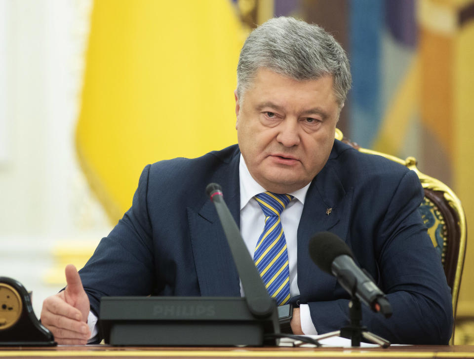 Ukrainian President Petro Poroshenko leads the National Security and Defence Council meeting in Kiev, Ukraine, Sunday, Nov. 25, 2018. Russia's coast guard opened fire on and seized three of Ukraine's vessels Sunday, wounding two crew members, after a tense standoff in the Black Sea near the Crimean Peninsula, the Ukrainian navy said. (Mykhailo Markiv, Presidential Press Service via AP, Pool)