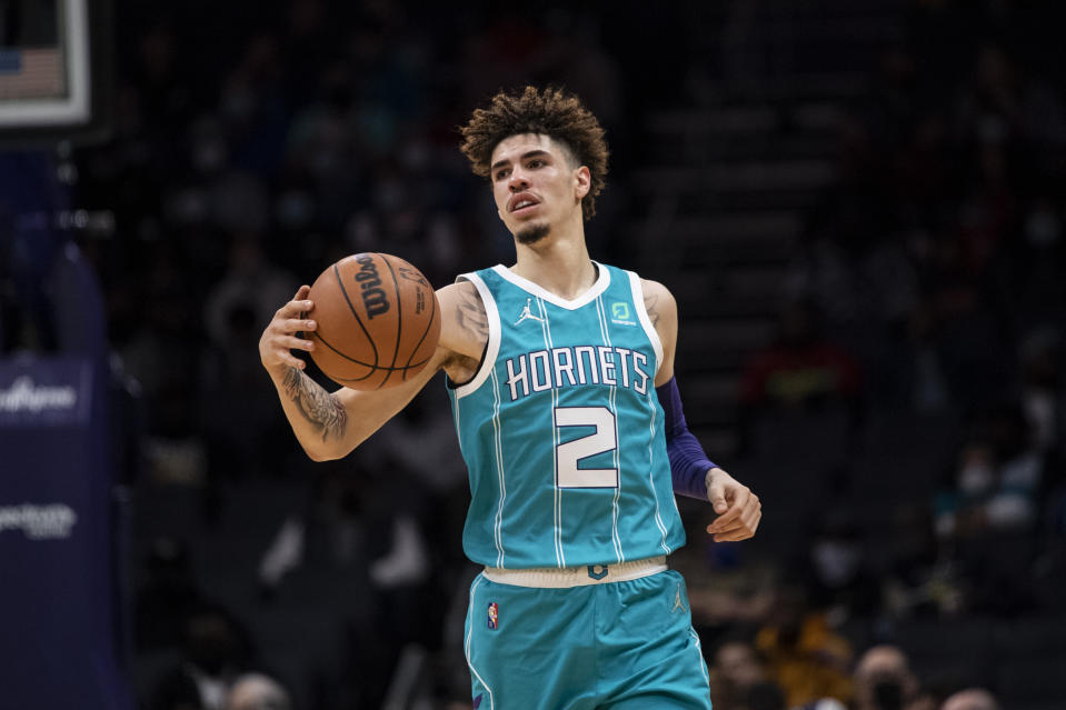 Charlotte Hornets guard LaMelo Ball (2) brings the ball up court during the first half of an NBA basketball game against Portland Trail Blazers, Sunday, Oct. 31, 2021, in Charlotte, N.C. (AP Photo/Matt Kelley)