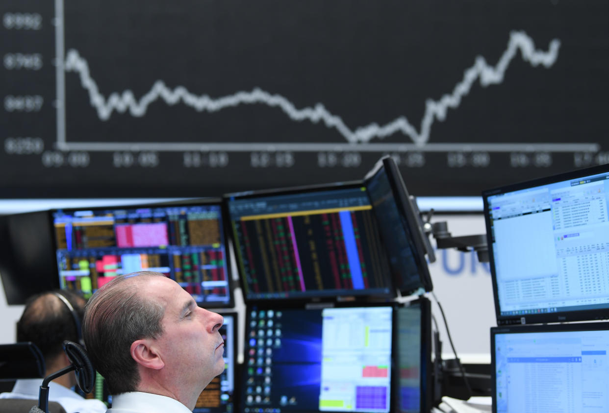 16 March 2020, Hessen, Frankfurt/Main: A stock trader sits in front of his monitors in the trading room of the Frankfurt Stock Exchange. As a result of the worsening coronavirus crisis, the German stock index Dax has fallen below the 9000 point mark. Photo: Arne Dedert/dpa (Photo by Arne Dedert/picture alliance via Getty Images)