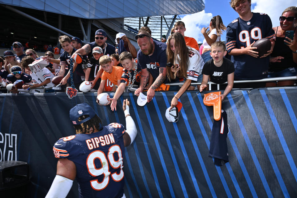 Aug 12, 2023; Chicago, Illinois, USA; Chicago Bears defensive lineman Trevis Gipson (99) greets fans after a game against the Tennessee Titans at Soldier Field. Mandatory Credit: Jamie Sabau-USA TODAY Sports ORG XMIT: IMAGN-710965 ORIG FILE ID: 20230812_sjb_qt0_059.JPG