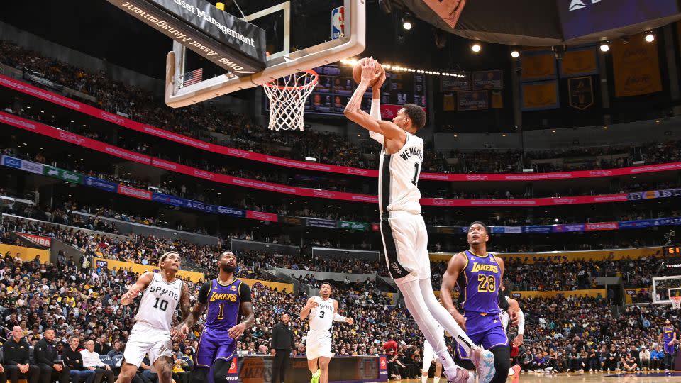 Victor Wembanyama dunks the ball during the game against the Lakers. - Andrew D. Bernstein/NBAE/Getty Images