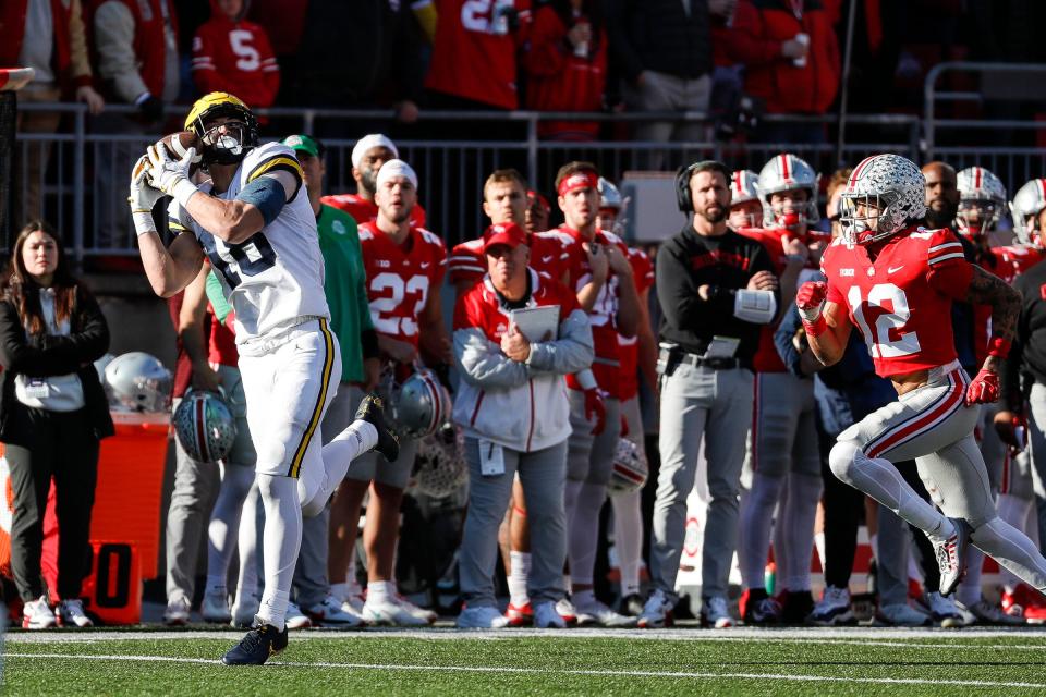 Michigan tight end Colston Loveland makes a catch against Ohio State safety Lathan Ransom during the second half at Ohio Stadium in Columbus, Ohio, on Saturday, Nov. 26, 2022.