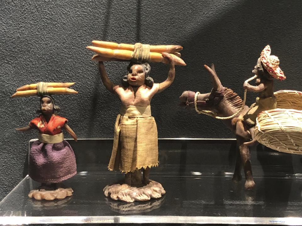 In this Nov. 24, 2019 photo, latex figures made in the 1940s depicting daily life in Jamaica in the sugar cane fields displayed at the International Slavery Museum in Liverpool, England. The museum seeks to tell the story of the enslavement of people from Africa and how the British city benefited from human bondage. (AP Photo/Russell Contreras)