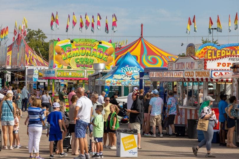 Families enjoy the carnival midway, which offers rides, games and attractions for all ages.