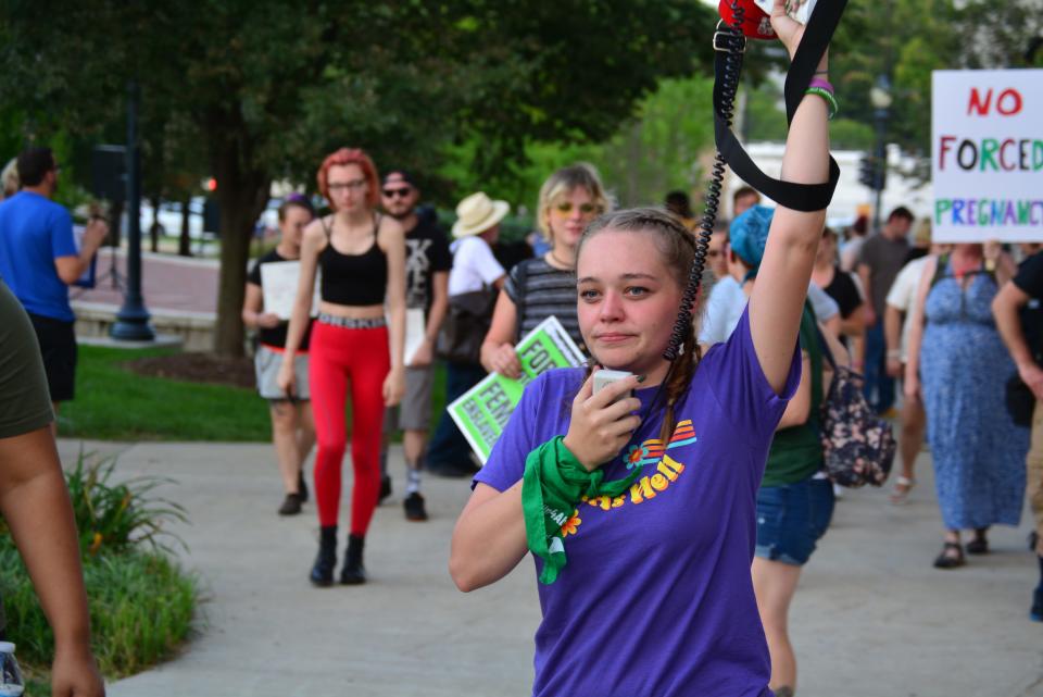 Melissa Cameron, CoMo for Progress leader and rally organizer, leads a protest march in August in support of abortion rights from the Boone County Courthouse.