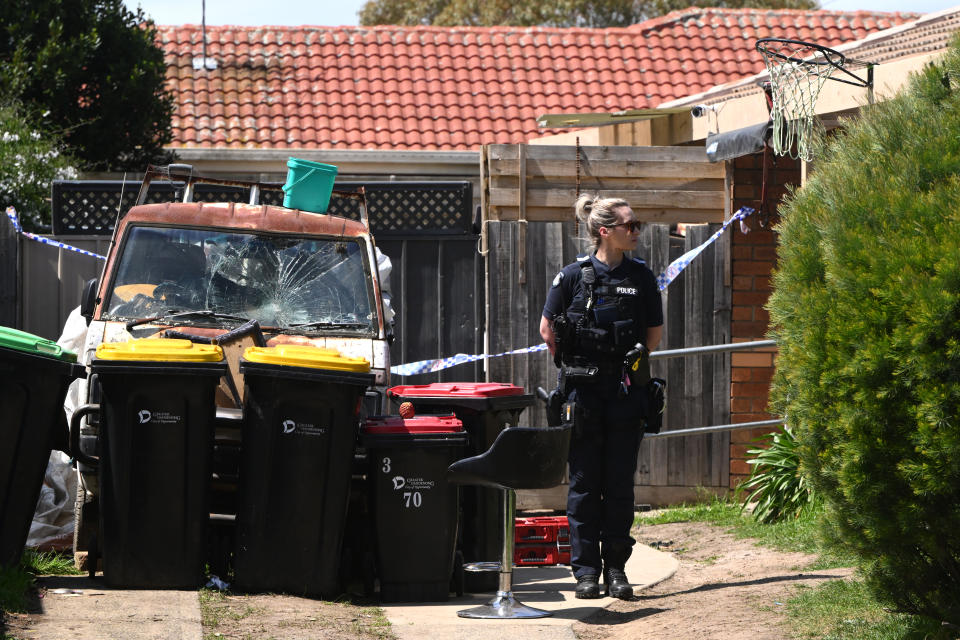 Victoria Police block access to a backyard at the scene of a dog attack in Dandenong on Thursday. Source: AAP